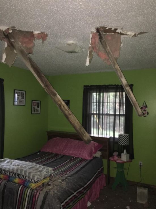 Beams from the shed went through the roof of the house.Â  (Juanita Propst - Facebook)